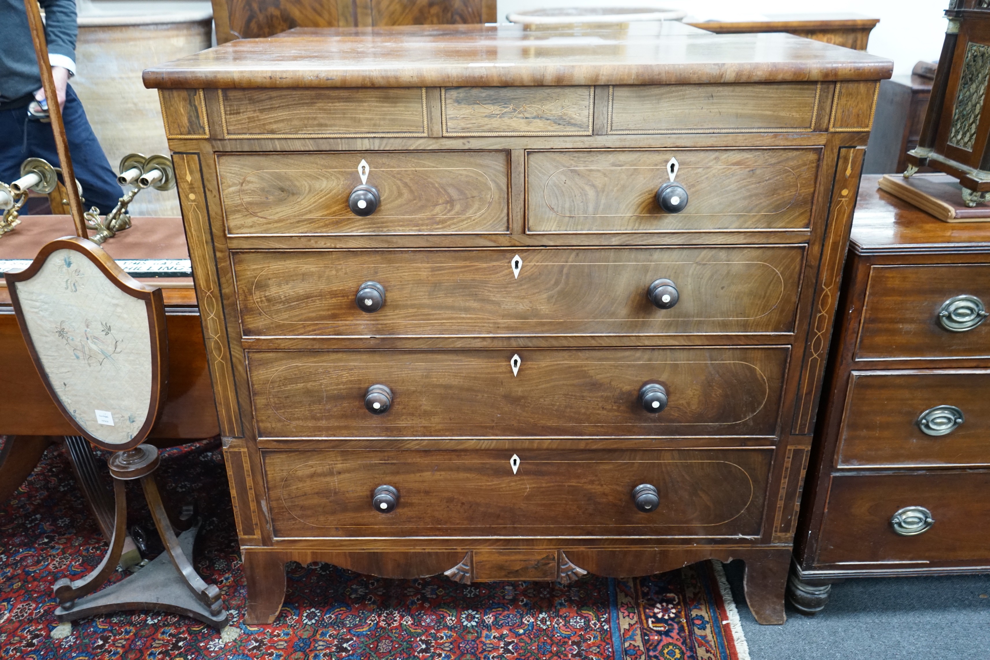 A George IV inlaid mahogany chest of eight drawers, width 122cm, depth 53cm, height 120cm